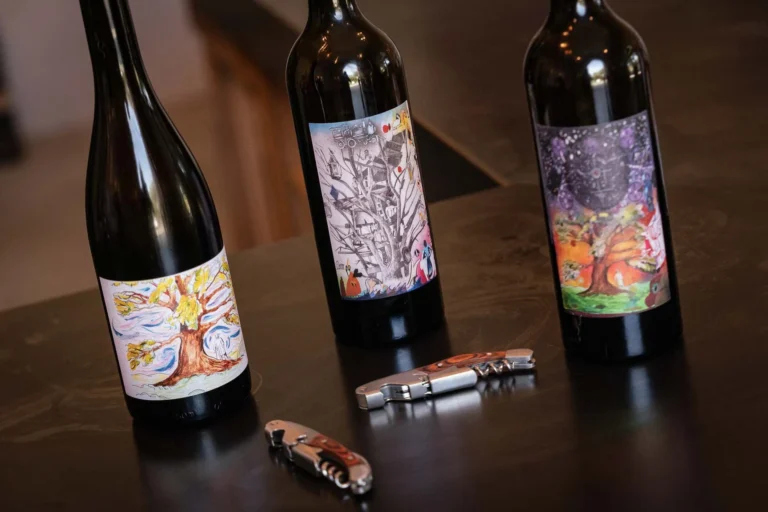 Bottles of wine and corkscrews on a table